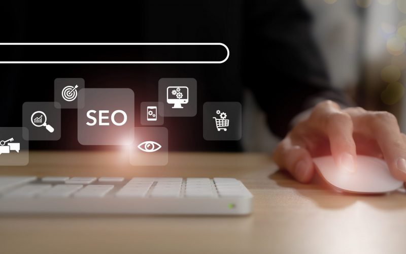 SEO, Search Engine Optimization ranking concept.  Digital marketing strategy of promote traffic to website. Working on computer with the icon of online search engine, abbreviation SEO and SEO symbol.